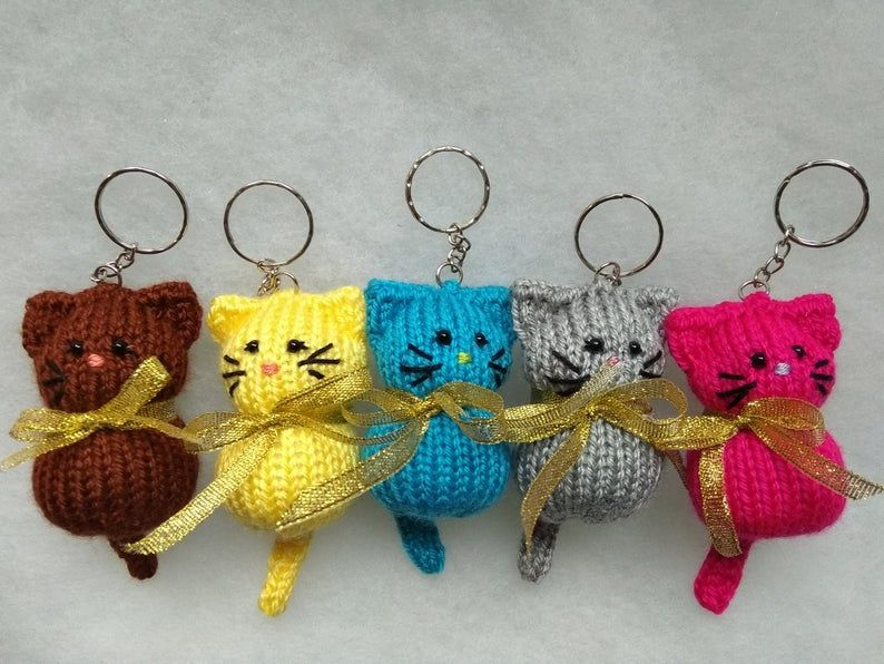 Four Crocheted Keychains With Cats On Them, One Has A Bow serapportantà Porte Clé Crochet Modèle Gratuit