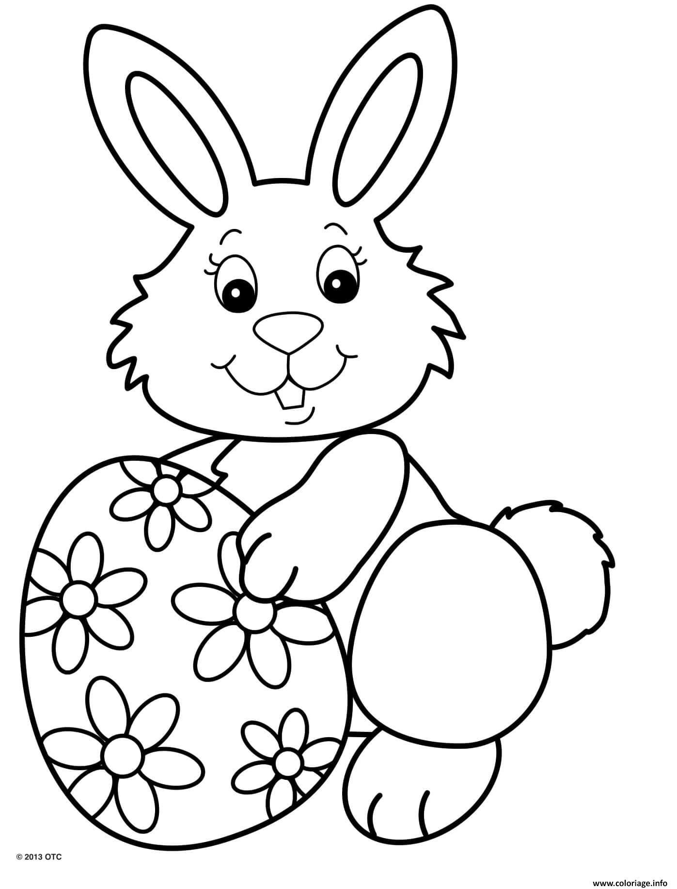 Coloriage Jolie Lapin Souriant Avec Un Oeuf De Paques Motif Fleurs à Lapin Imprimer